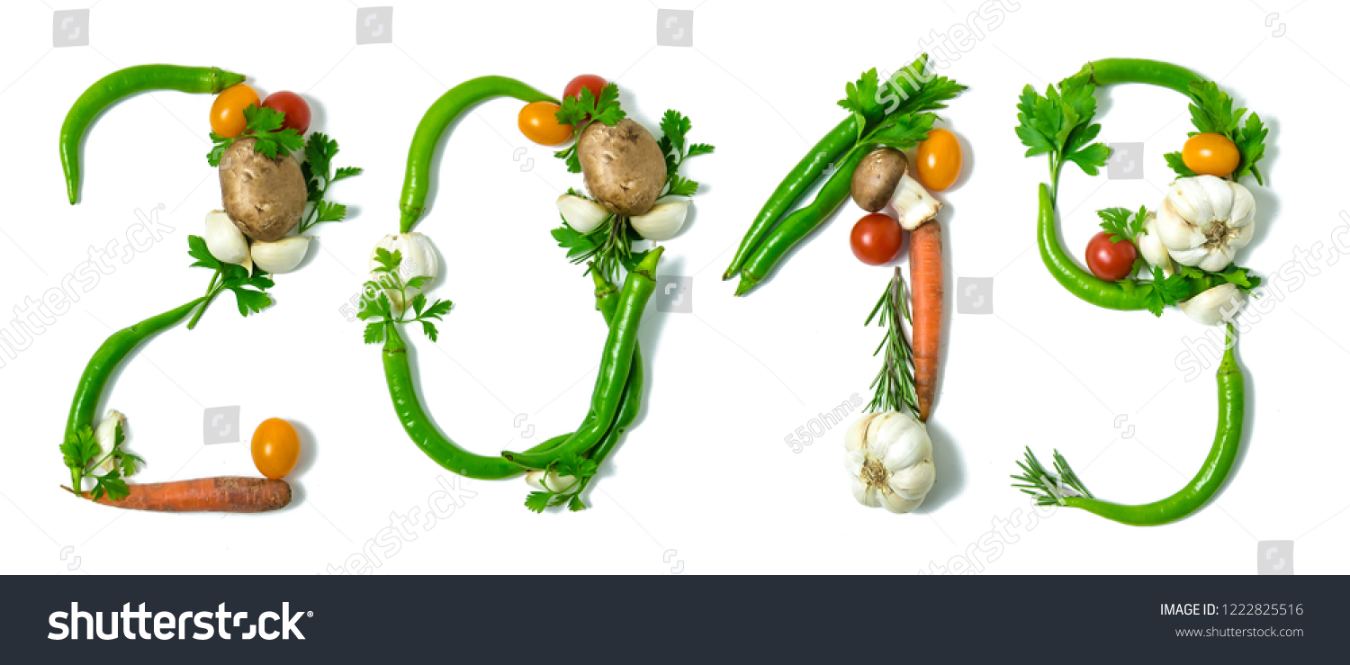 Number 2019 written with vegetables, as a metaphor or concept for healthy food, living, diet, recipe. Isolated on white background. Happy new year. End of the year resolution  #1222825516