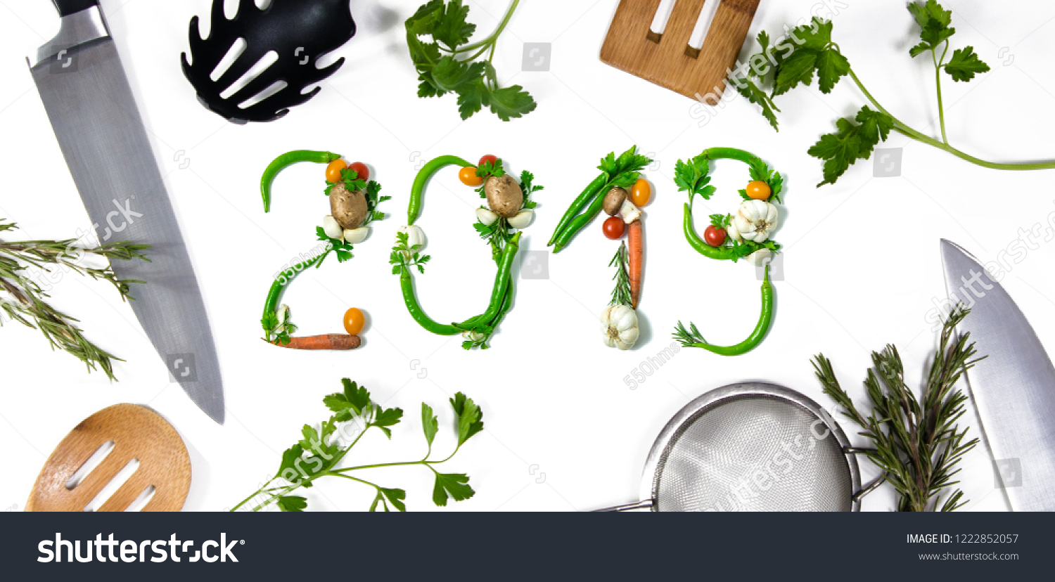Number 2018 written with vegetables and kitchen utensils as advertising or presentation in food industry, menus, brochures. Isolated on white background. Happy new year. End of the year resolution #1222852057