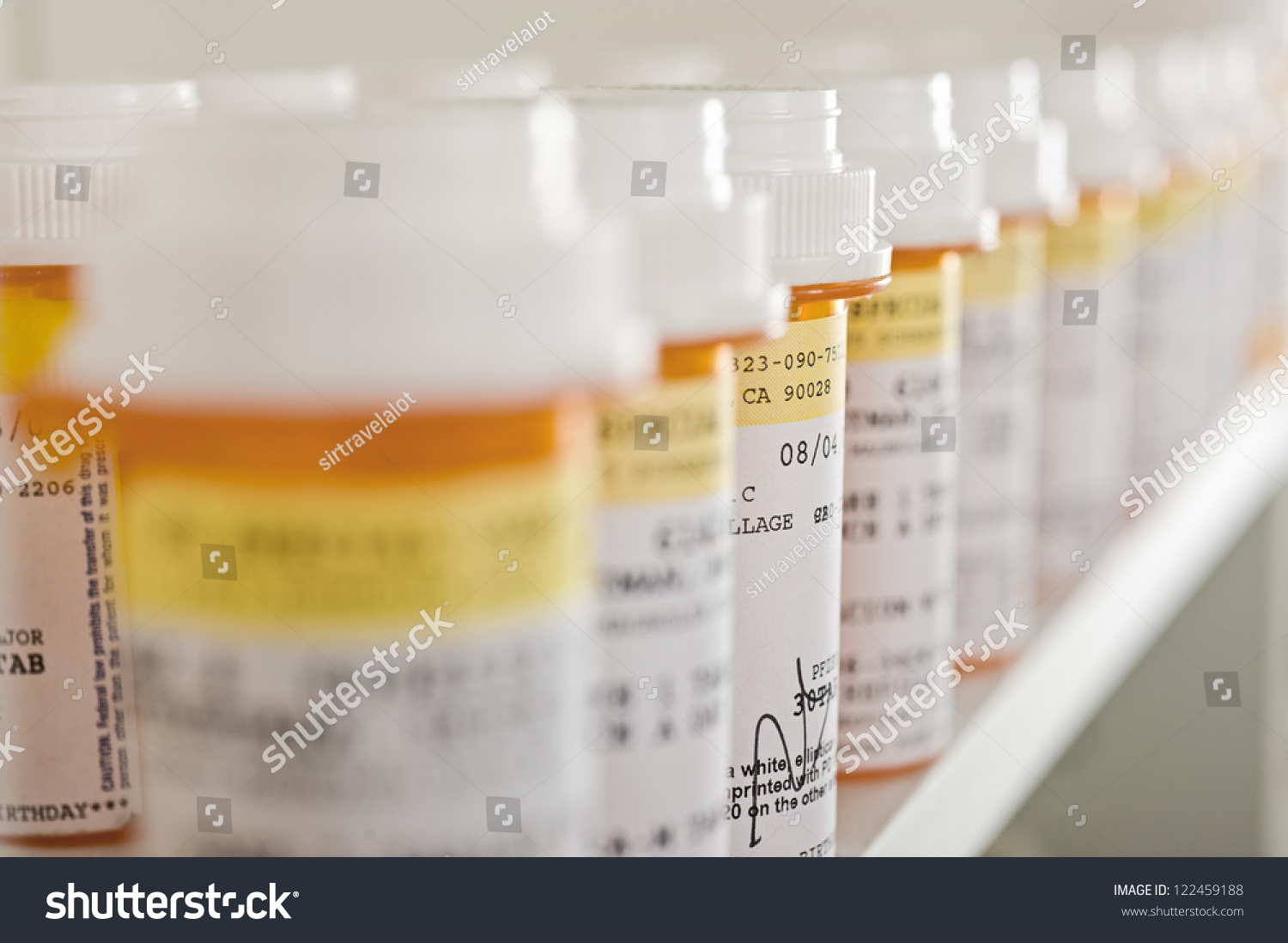 Bottles of pills arranged on shelf at drugstore #122459188