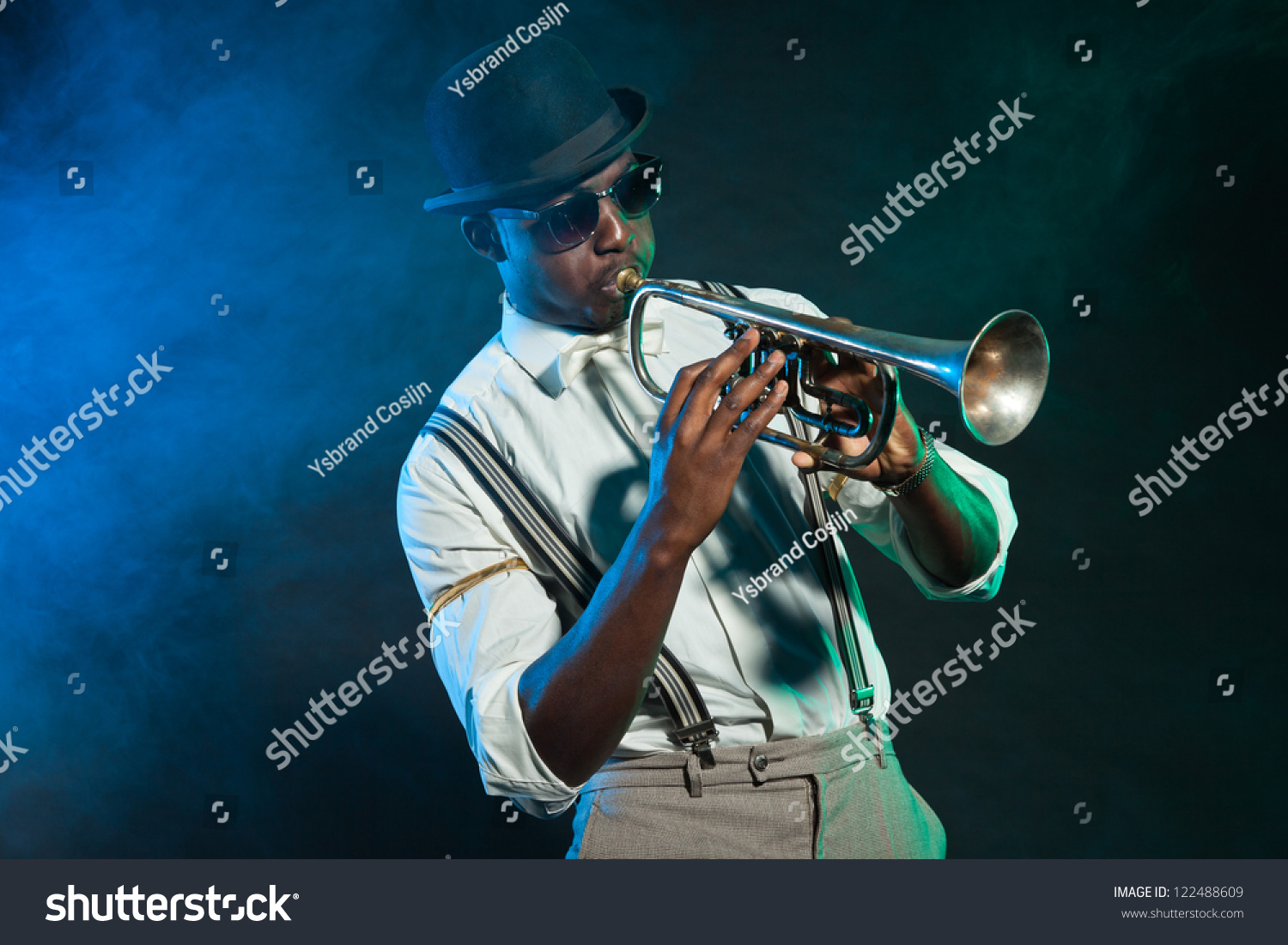 Black african american jazz trumpet player. Vintage. Studio shot. #122488609