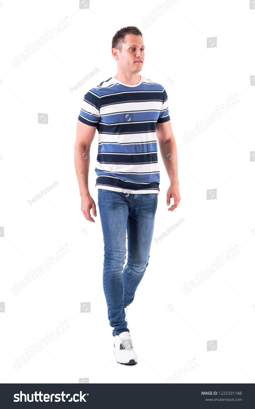 Cool relaxed casual man wearing t-shirt and jeans walking casually. Full body isolated on white background.  #1225331188