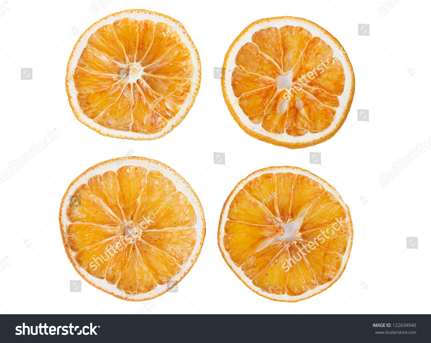 four dried slices of orange isolated on white background #122634940