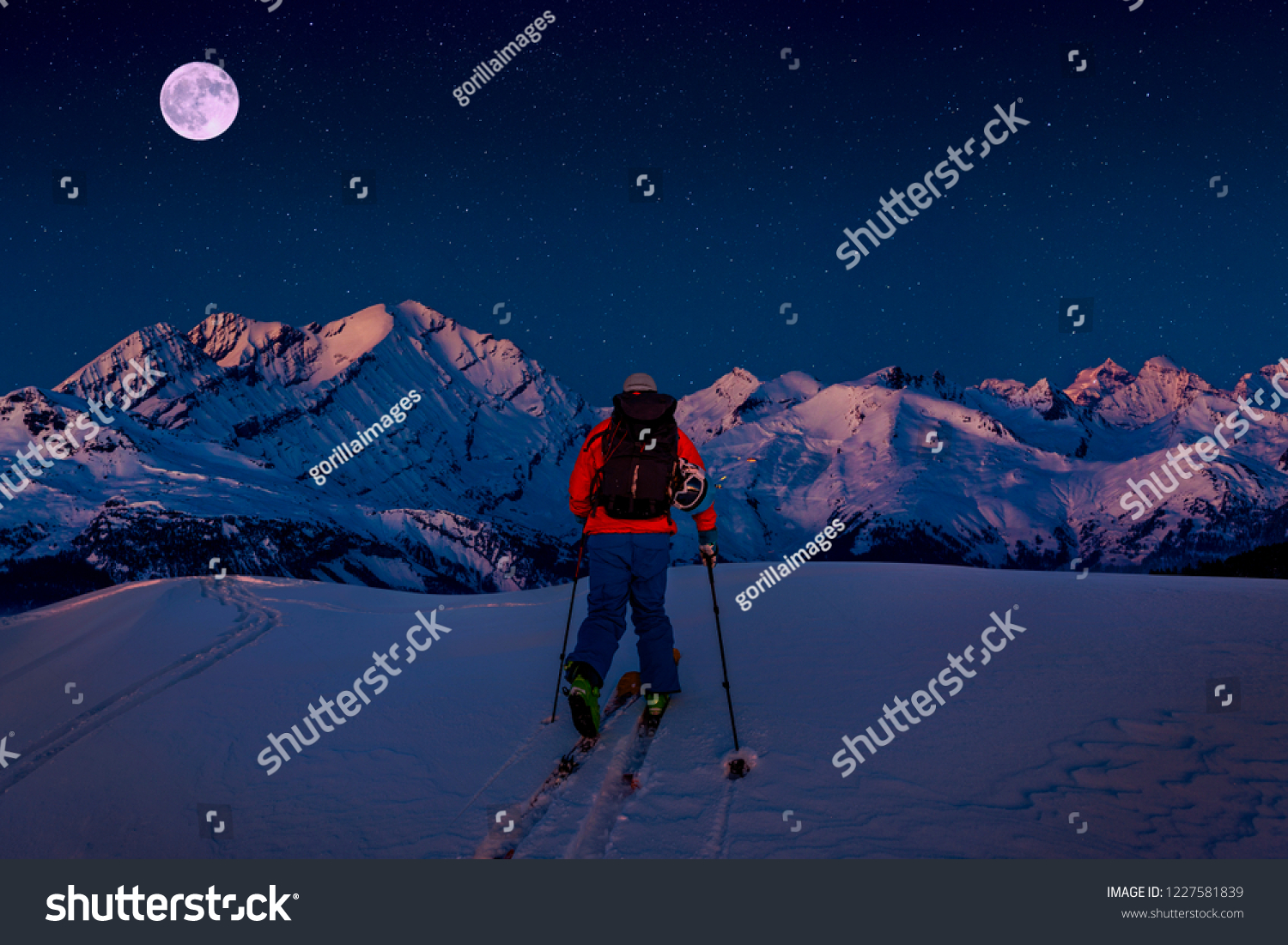 Night ski with amazing view of swiss famous mountains in beautiful winter snow. The skituring, backcountry skiing in fresh powder snow. #1227581839