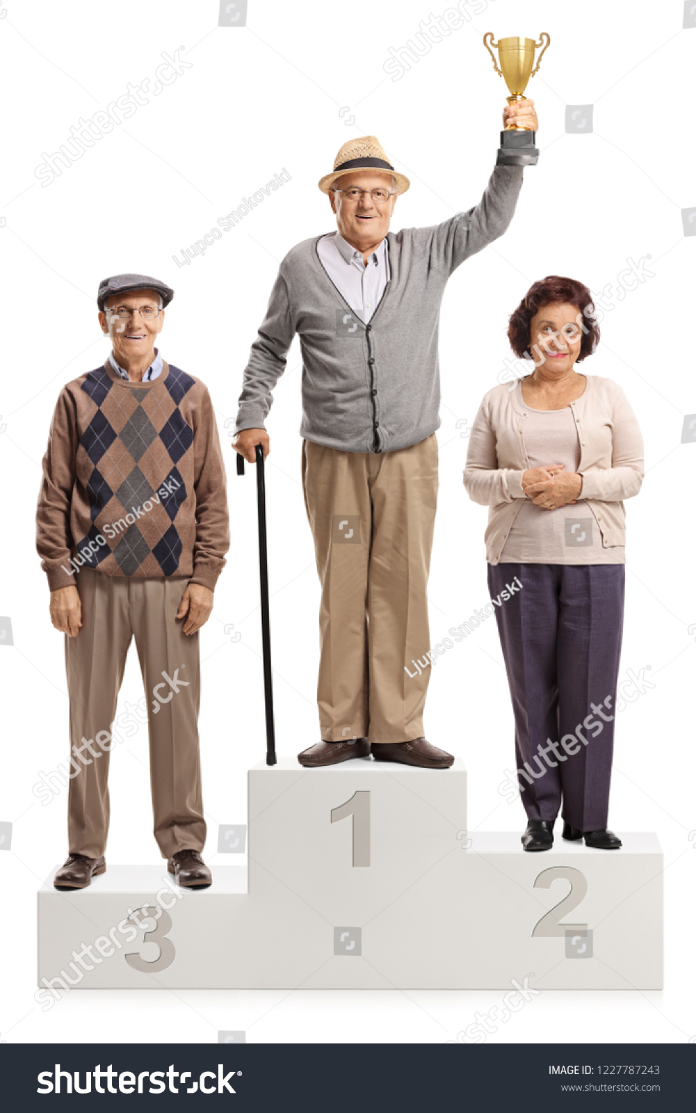 Full length portrait of senior people on a winner's pedestal for first second and third place isolated on white background #1227787243
