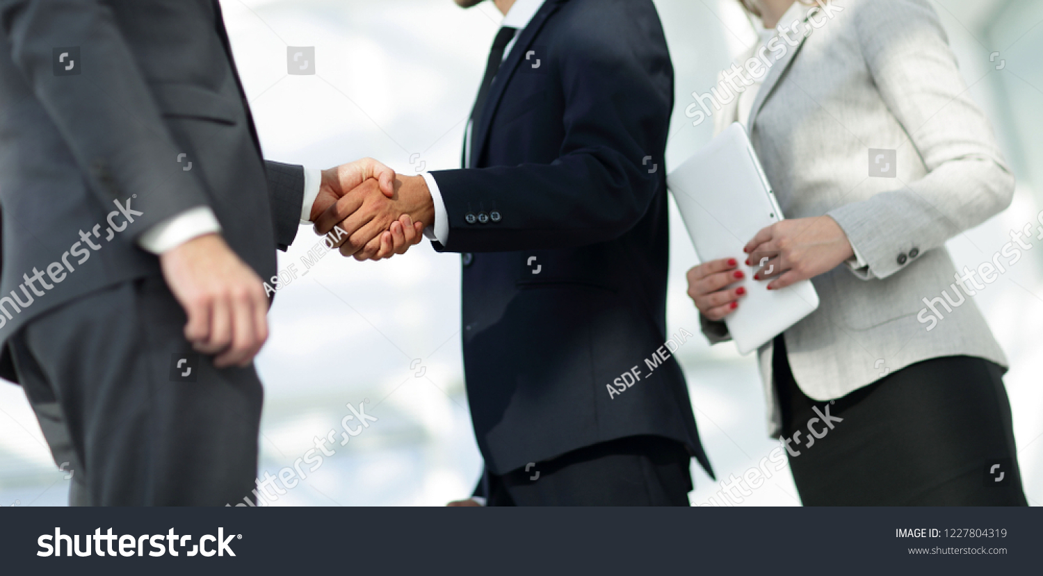 Business handshake and business people. #1227804319