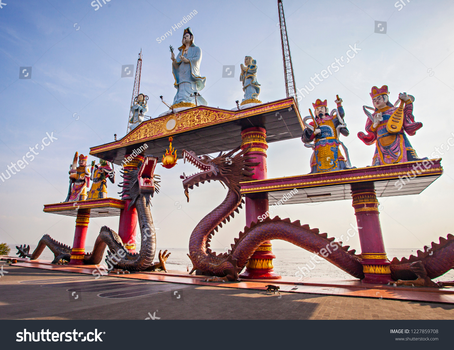 Statue of Dragons and Kwan yin in Sanggar Agung Temple or Hong San Tang. It is a Chinese temple in Surabaya  that located within Kenjeran Park, the Pantai Ria amusement park. #1227859708