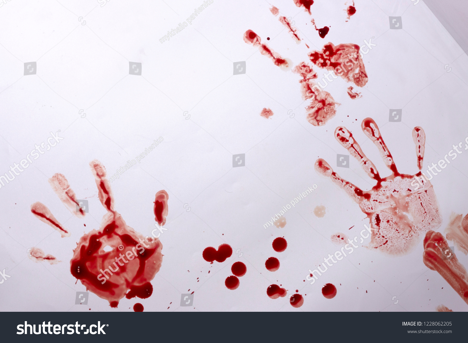 Red imprint of the bloody palm on a white background #1228062205
