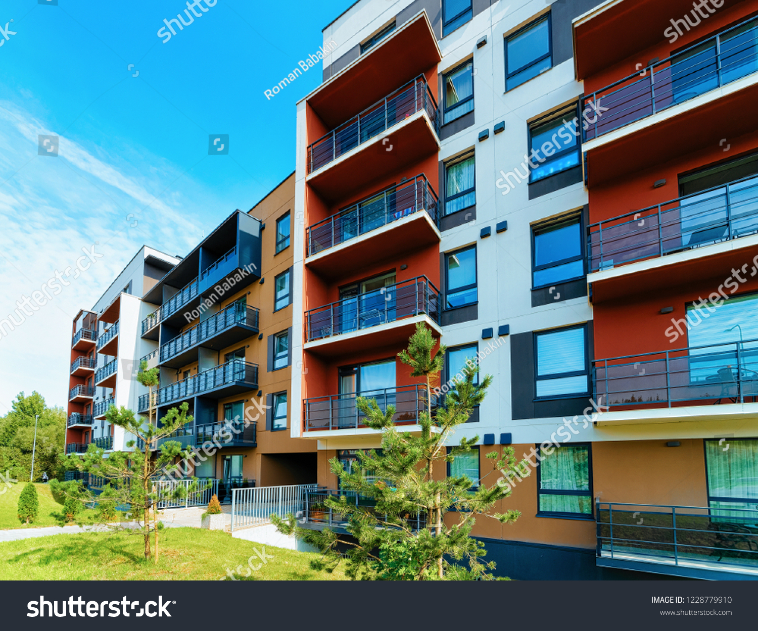 Modern apartment flat building real estate exterior concept. Outdoor residential home facilities. #1228779910