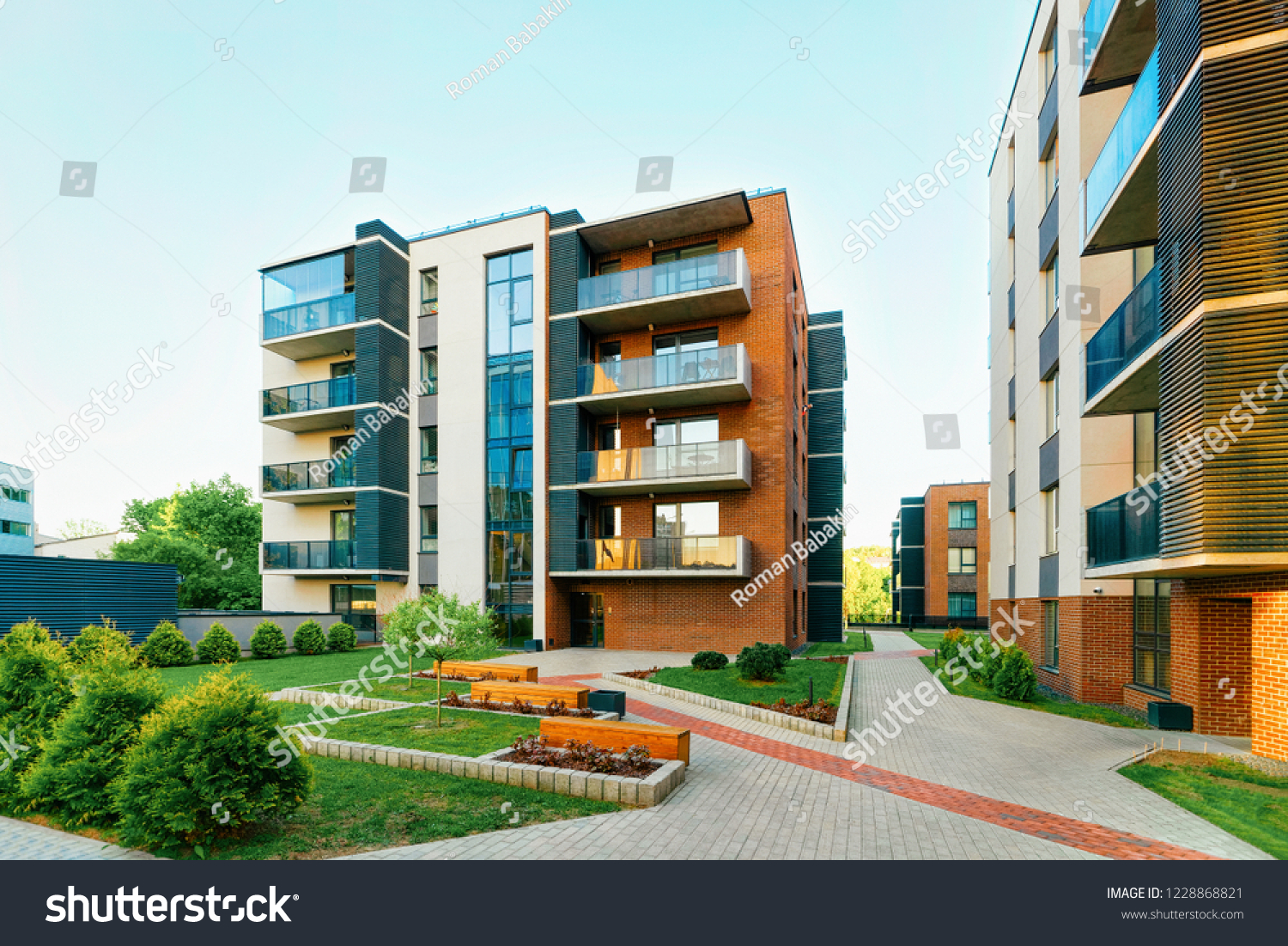 Modern new residential apartment house building complex, with outdoor facilities concept. With benches