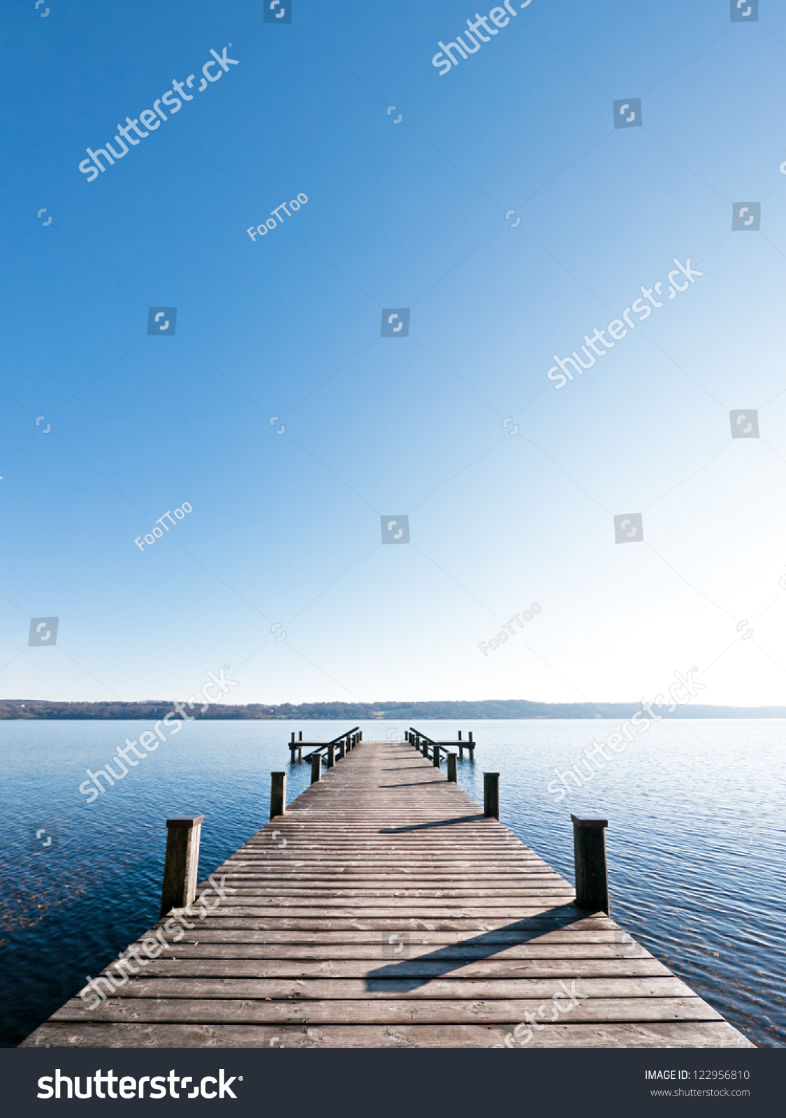 old wooden jetty at a lake #122956810