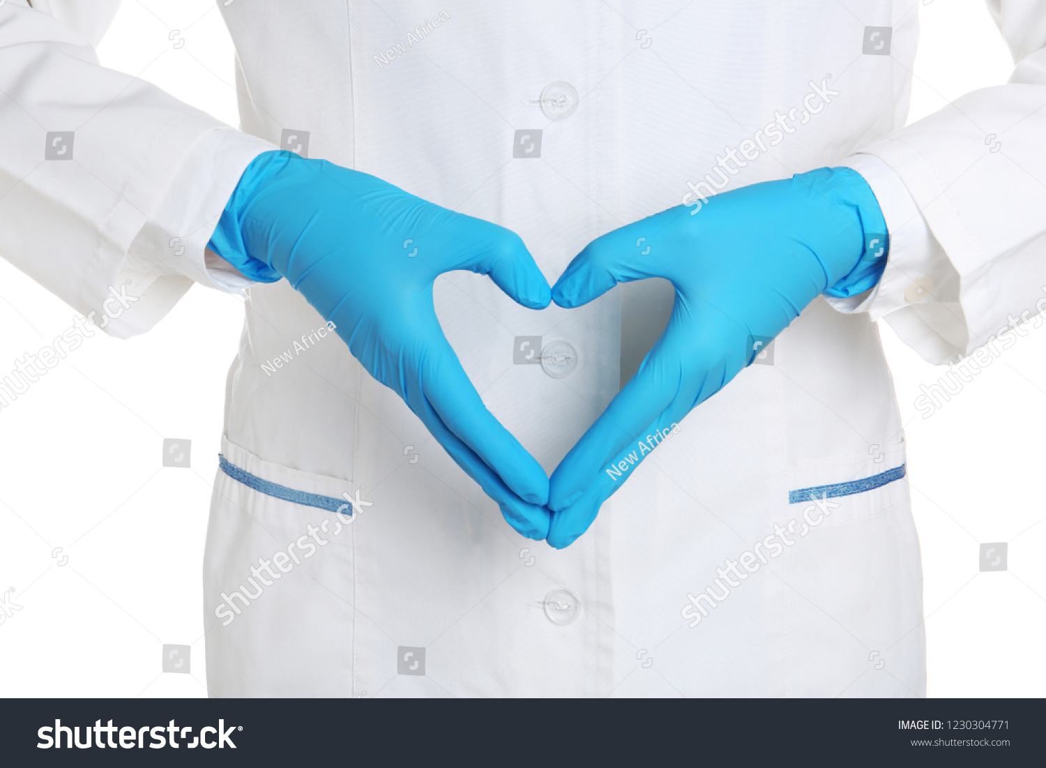 Doctor making heart shape with hands in medical gloves on white background #1230304771