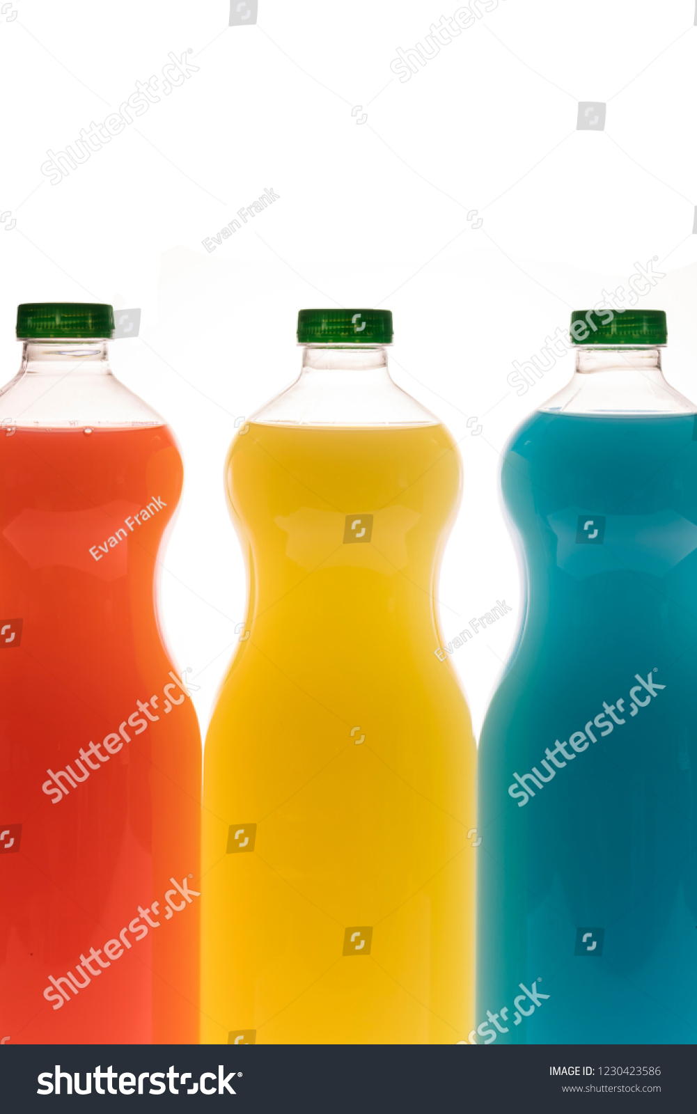 
Bottles of different flavored juices, watermelon, pineapple and tropical flavor isolated on white background #1230423586