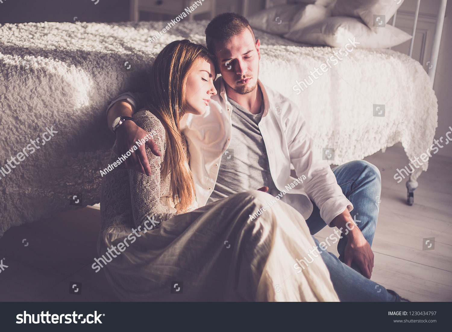 Fashionable stylish caucasian couple in love in bedroom hugging each other. Tender relationship, freedom lifestyle #1230434797