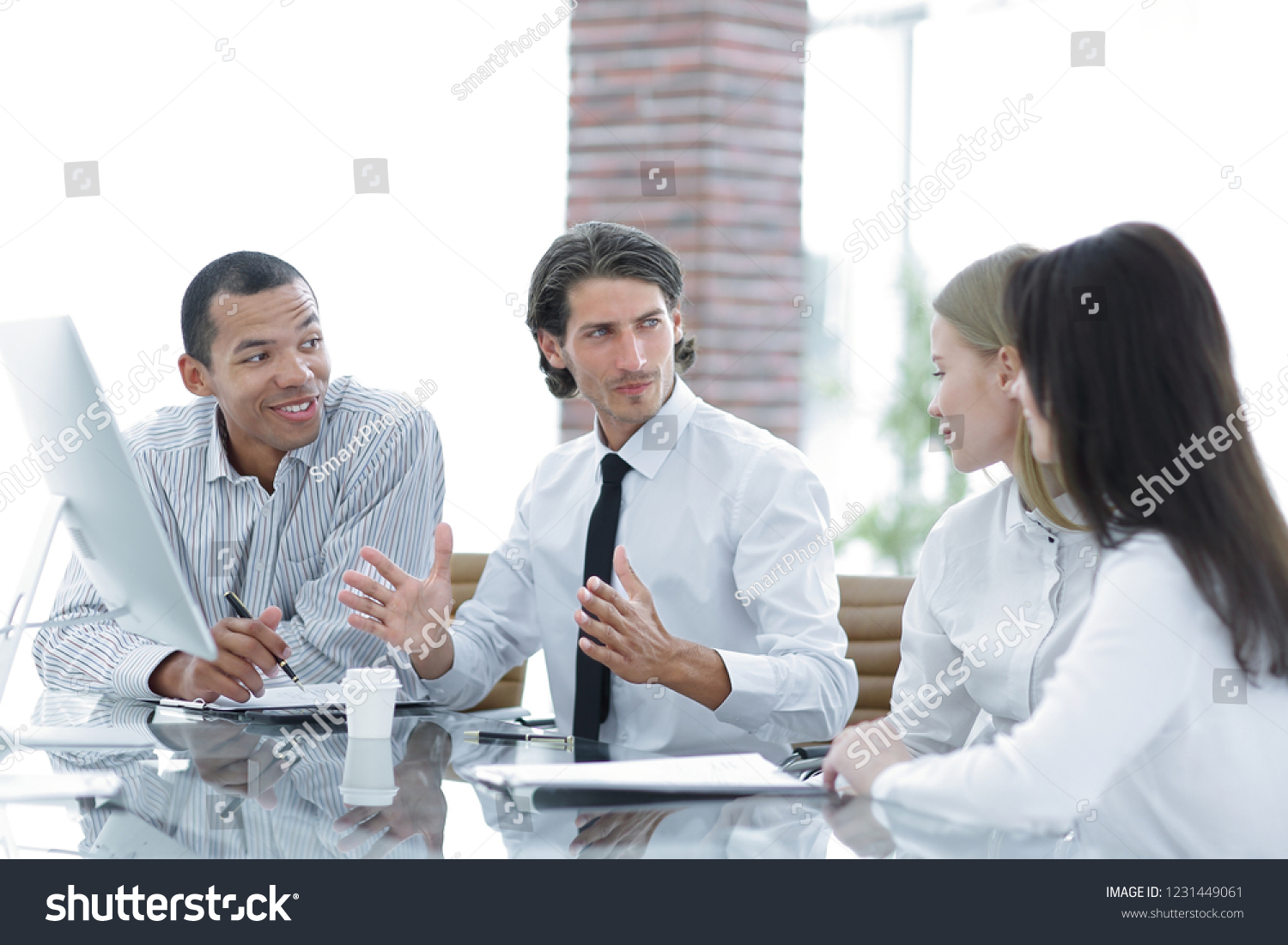 Manager holds a meeting with the business team #1231449061