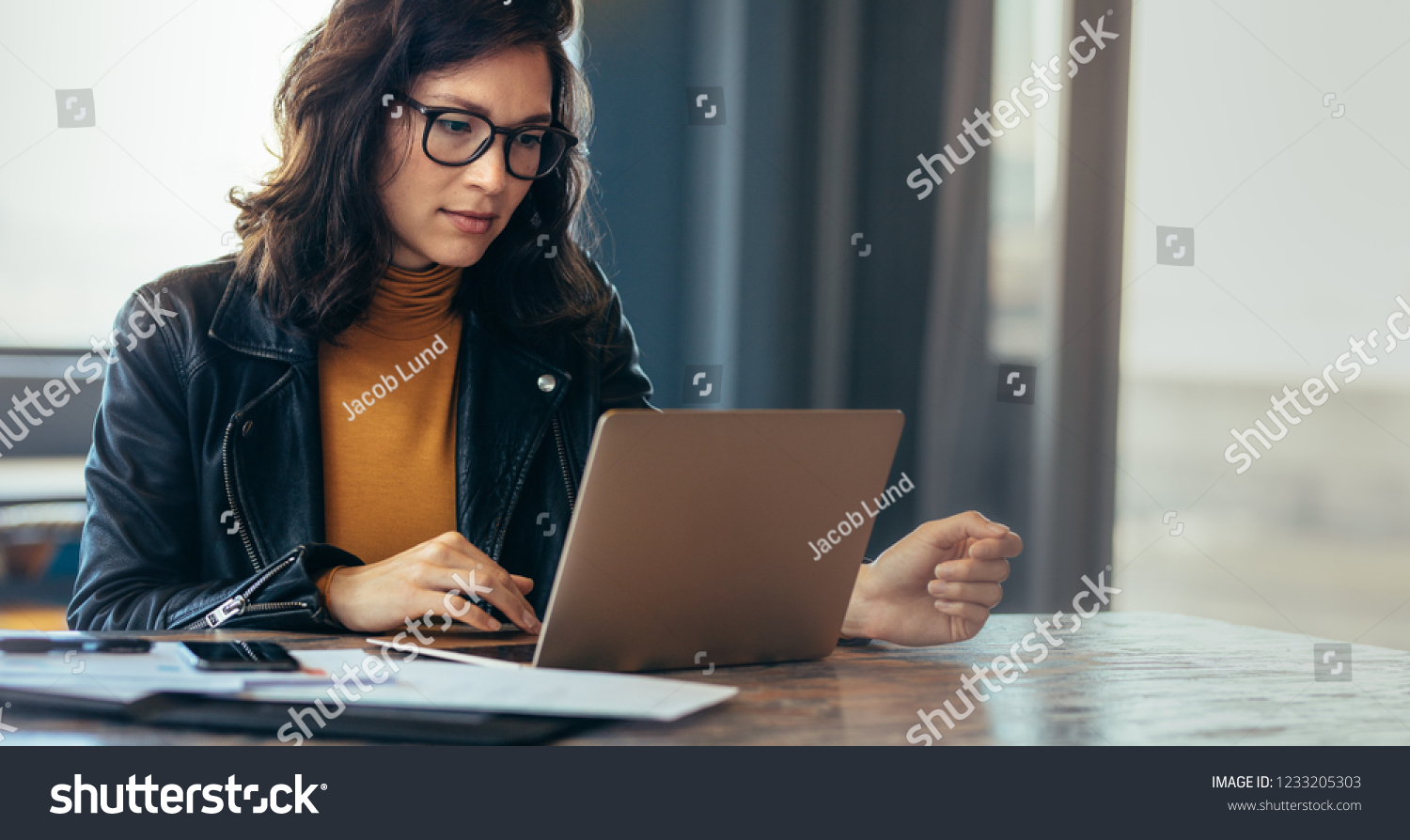 Asian woman working laptop. Business woman busy working on laptop computer at office. #1233205303