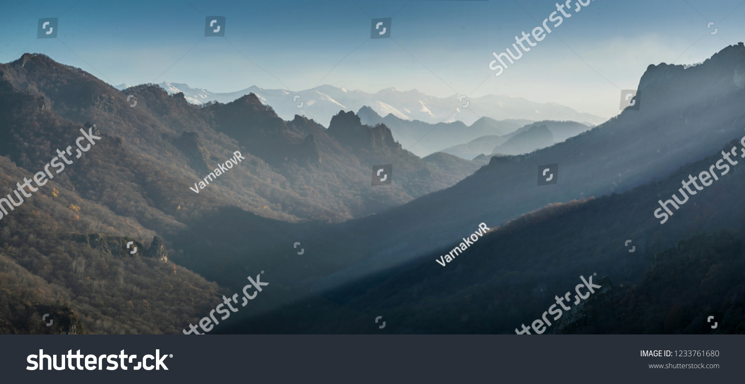 View on Caucasus mountain range with autumn forest valley, Shoana Church viewpoint in Karachaevsk, Russia #1233761680
