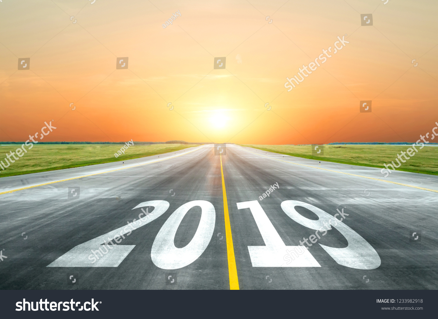 View of the peaceful open road against the setting sun forward to new 2019 year. Concept of success in the future #1233982918