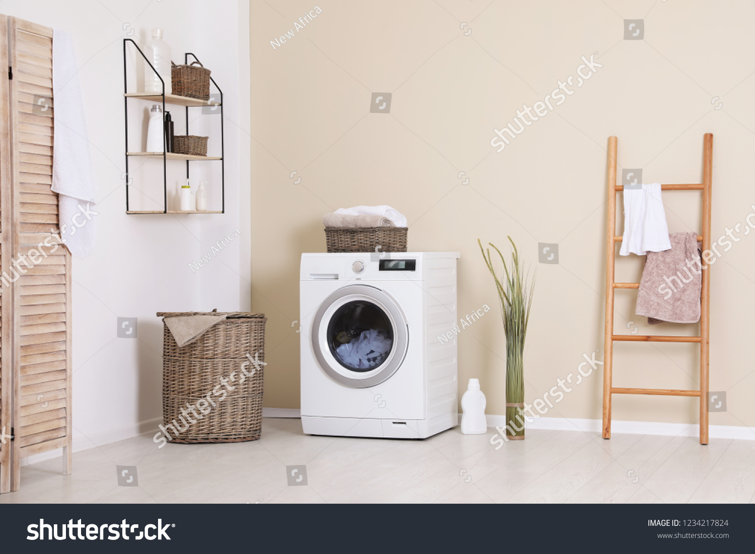 Laundry room interior with washing machine near wall #1234217824