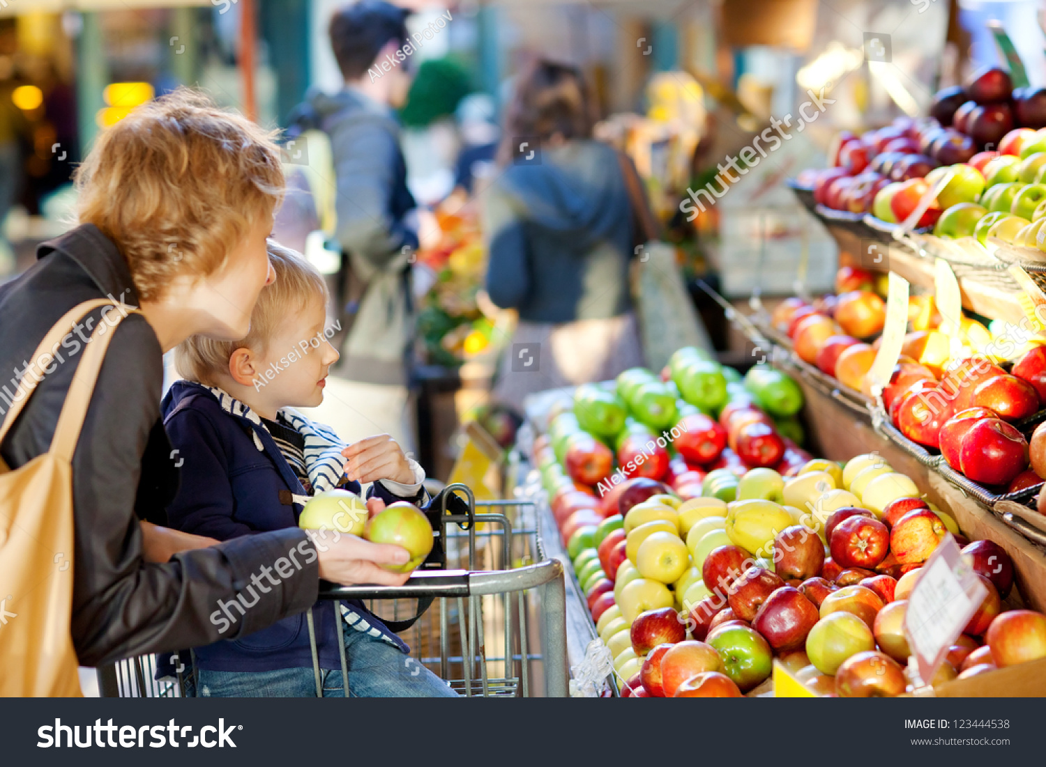 mother and her son buying fruits at a farmers market #123444538