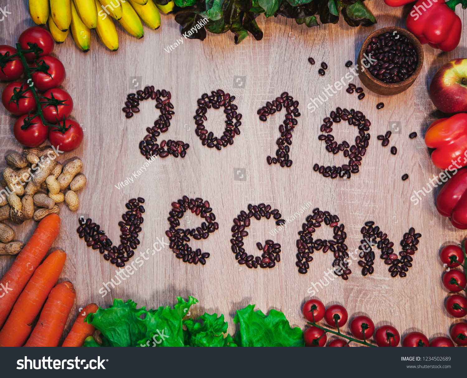 Go vegan concept green organic vegetables & bean on wood background. #1234502689