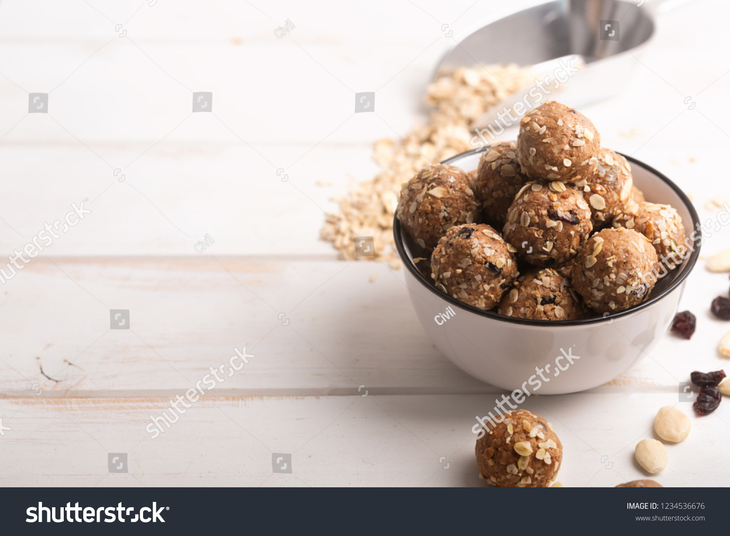 If you have a question how to make the no bake energy bites - just mix all ingredients, such as nuts, cocoa, chocolate, oats together in a large bowl until combined. Wooden background #1234536676