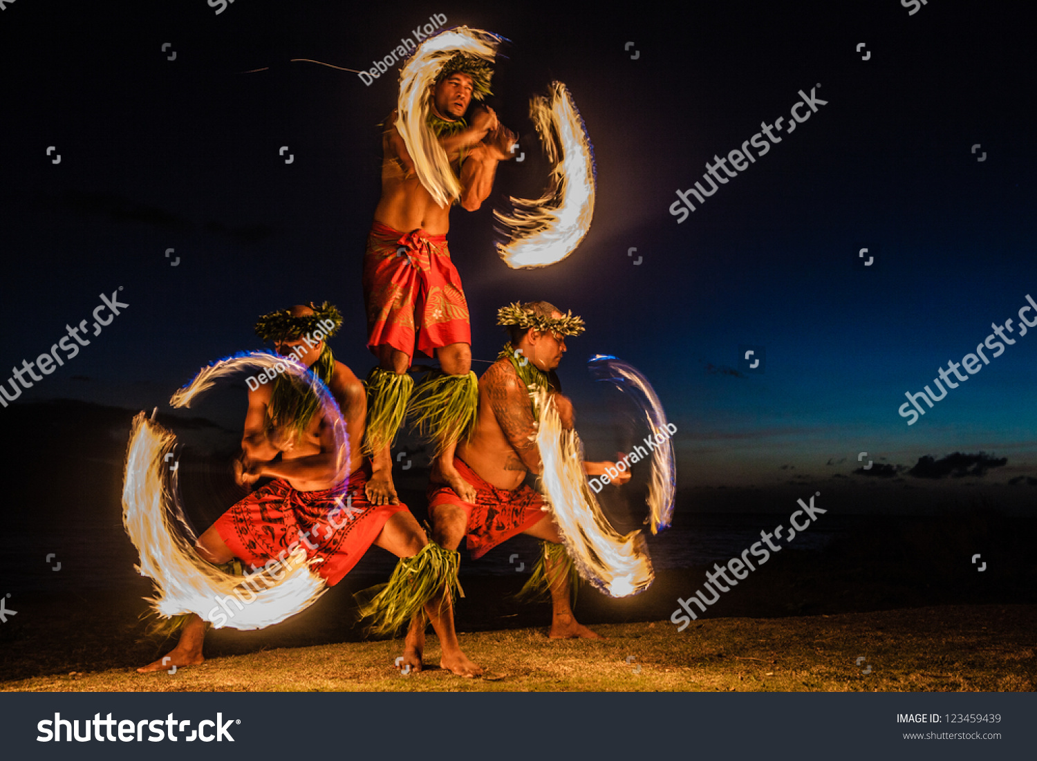 Three Strong Men Juggling Fire in Hawaii - Fire Dancers #123459439