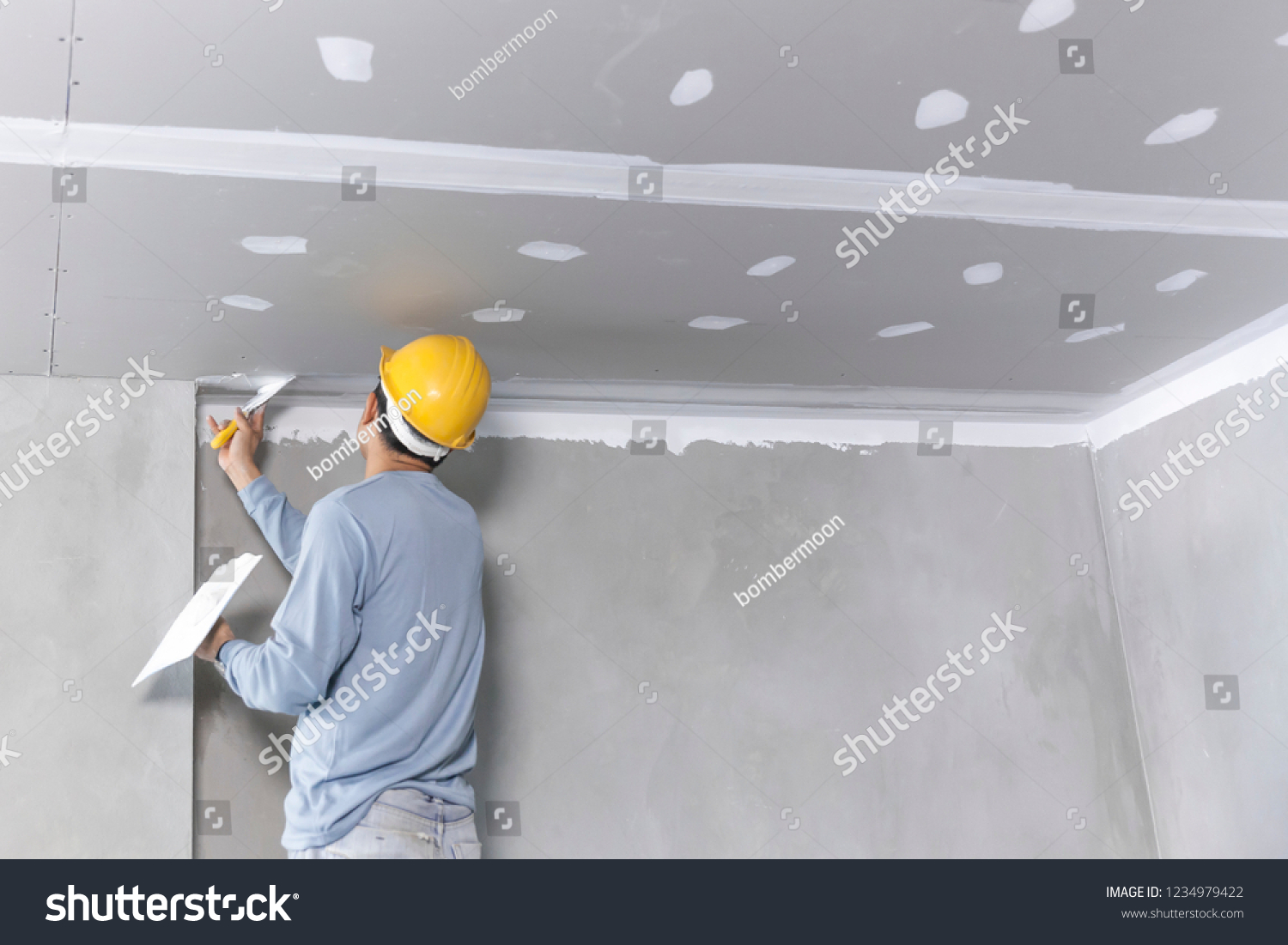Craftsman working
with plaster gypsum ceiling for interior build gypsum board ceiling #1234979422