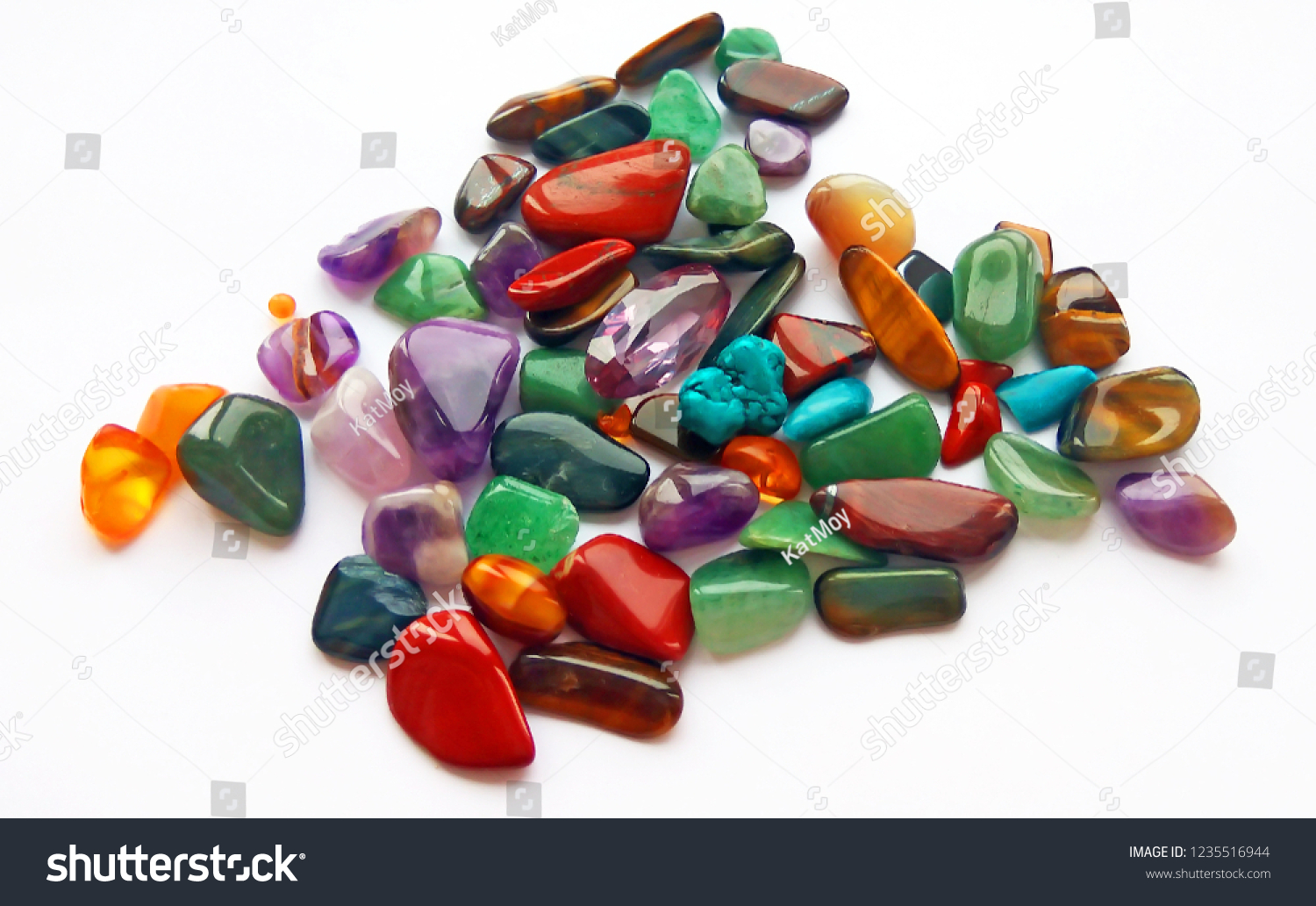 Assorted natural bright coloured semi precious gemstones and gems on white background #1235516944