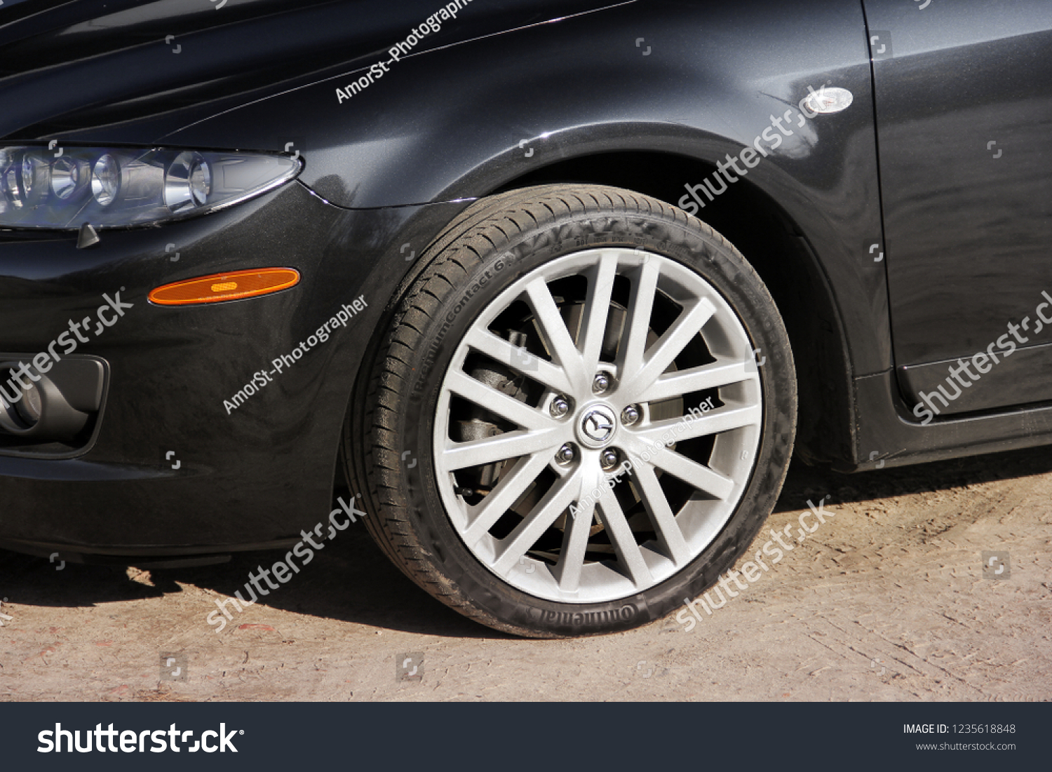 Chernihiv, Ukraine - November 7, 2018: Part of a Mazda 6 MPS car. Wheels and tires "Continental" #1235618848
