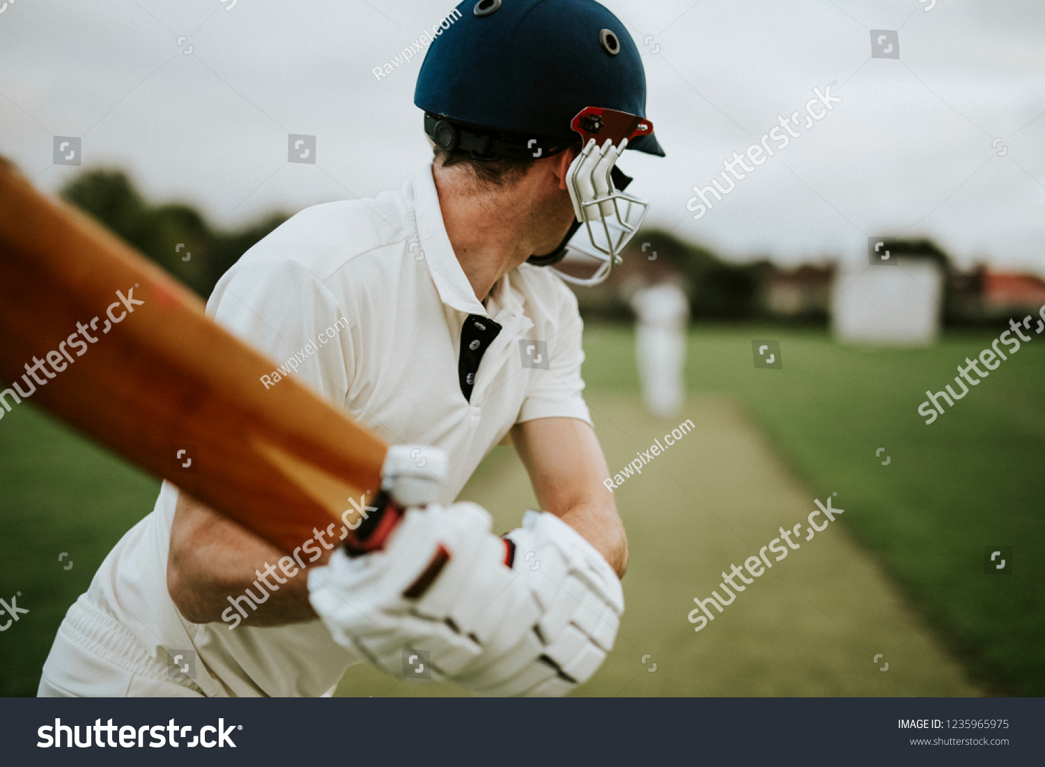 Cricketer on the field in action #1235965975