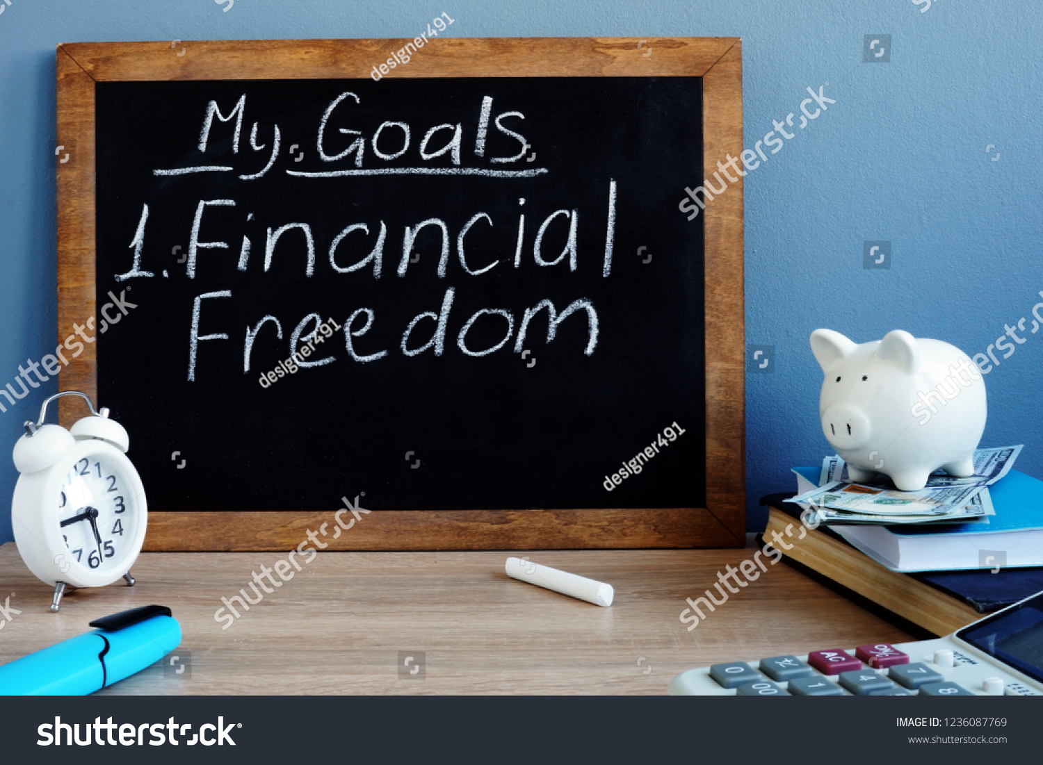 My goals and financial freedom written on a blackboard. #1236087769