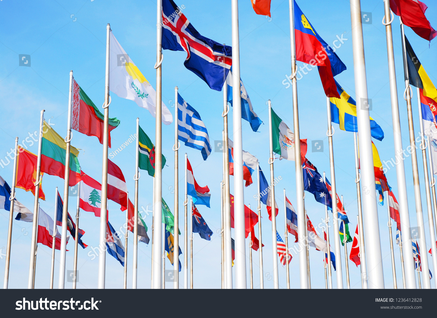 Flags of many countrys of the world,  waving in the sky #1236412828