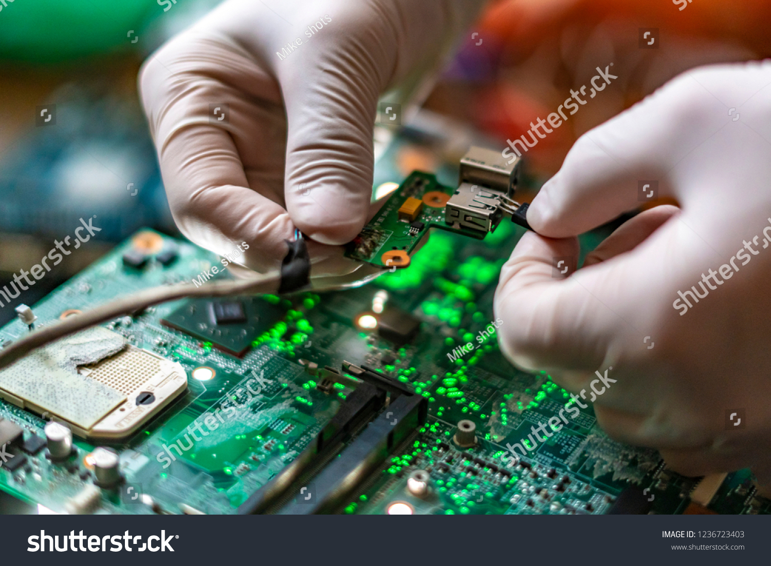 scientist assemble the modern technology gadget pieces in the laboratory #1236723403