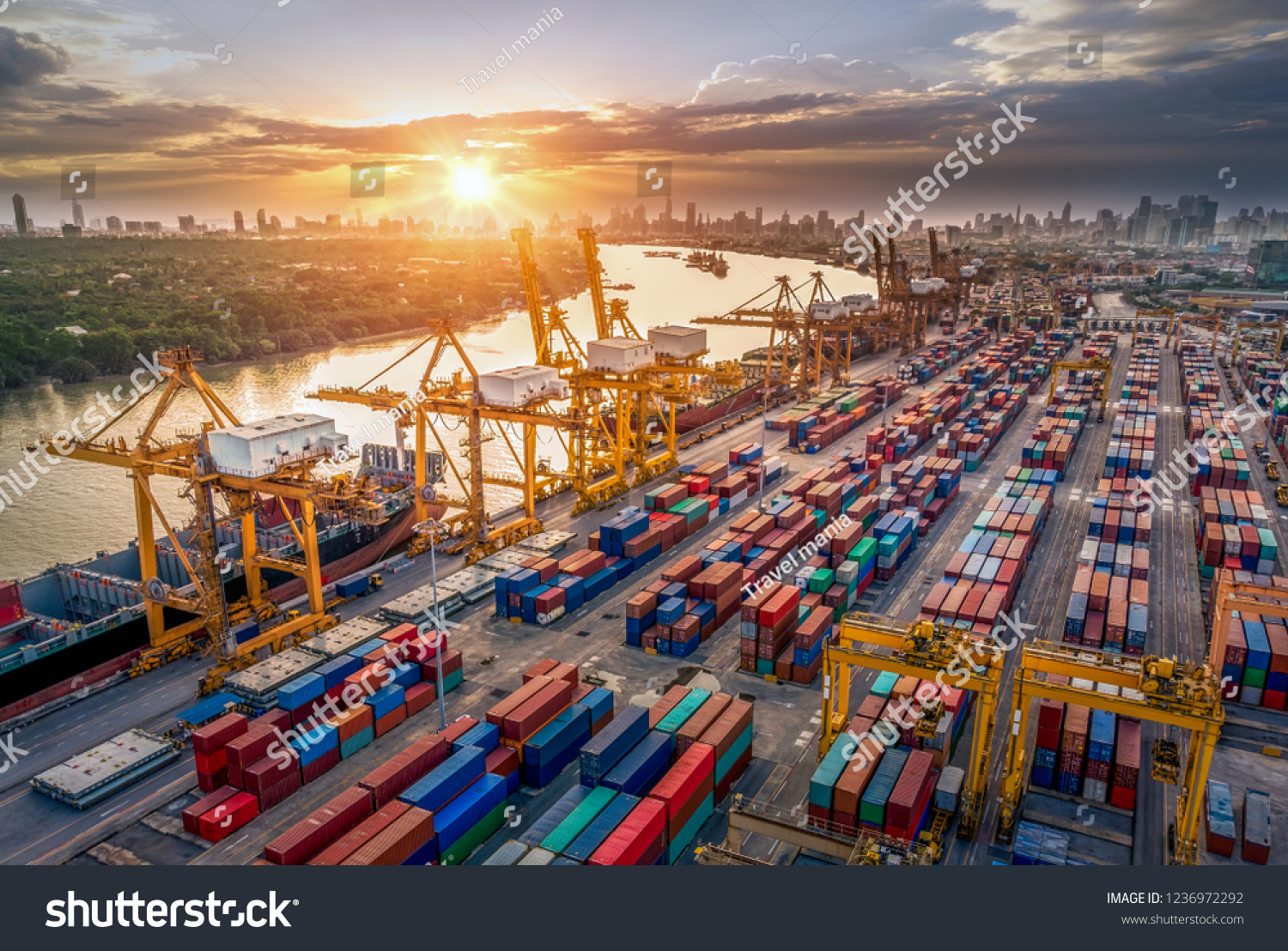 Logistics and transportation of Container Cargo ship and Cargo plane with working crane bridge in shipyard at sunrise, logistic import export and transport industry background #1236972292