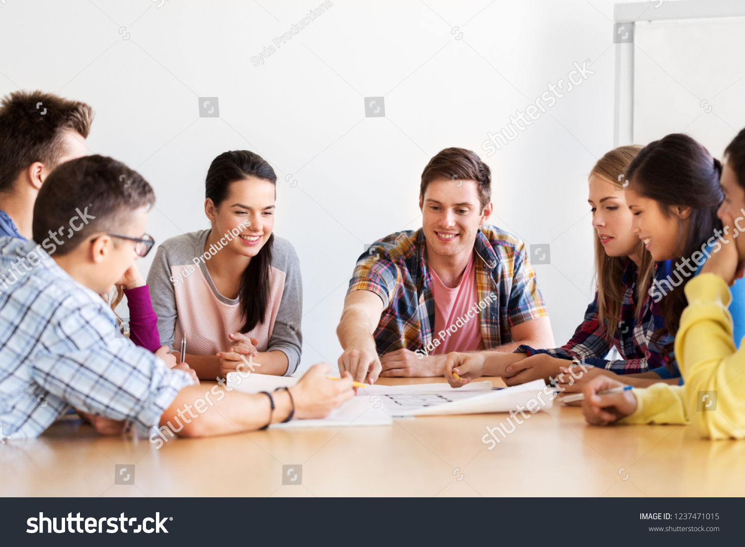 education, architecture and people concept - group of smiling students meeting at school #1237471015