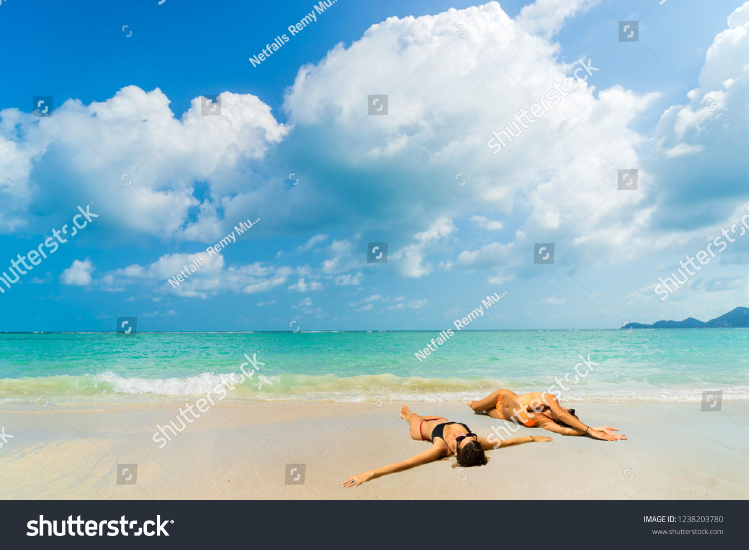 Woman suntanning - Winter holidays at the tropical beach #1238203780