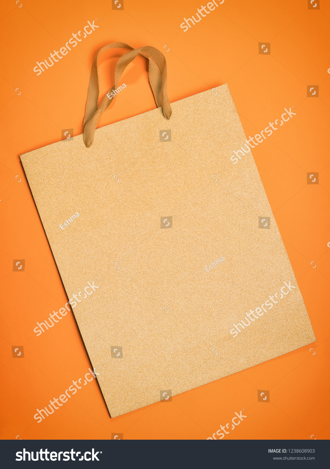 Gift bag on orange. Flat composition with copy space #1238608903