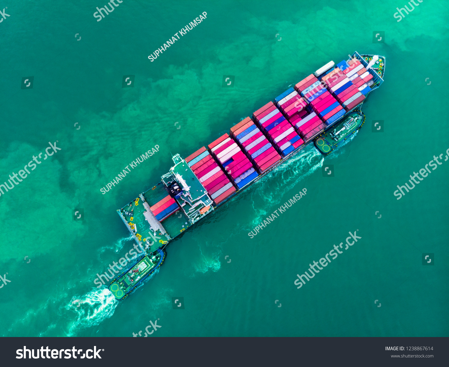 Aerial top view of cargo container ship and trug ship working dragging vessel to yard port concept freight shipping ship , logistic service and transportation. #1238867614