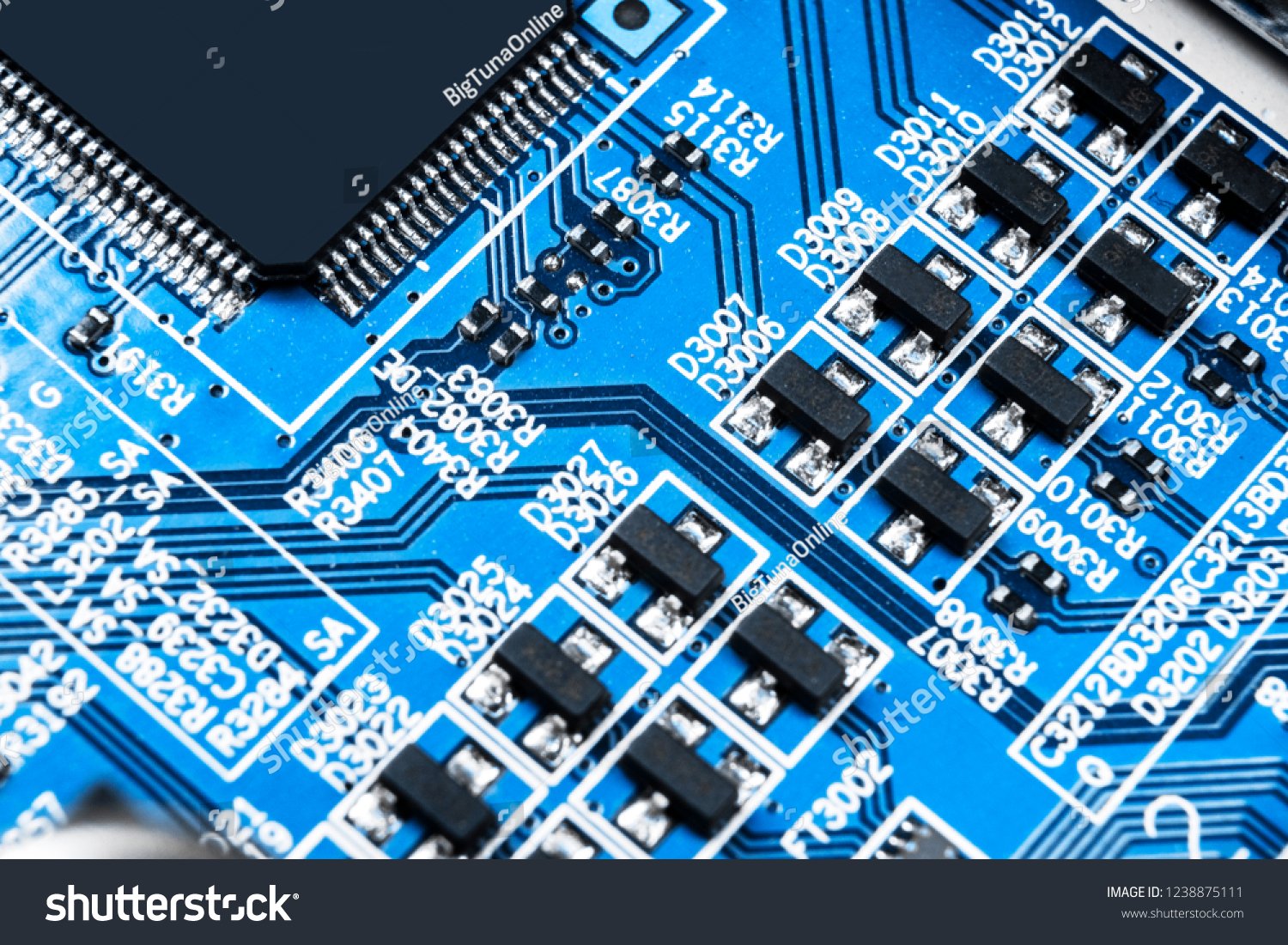 Macro shot of a Circuitboard with resistors microchips and electronic components. Computer hardware technology. Integrated communication processor. Information engineering. Semiconductor. PCB. Closeup #1238875111