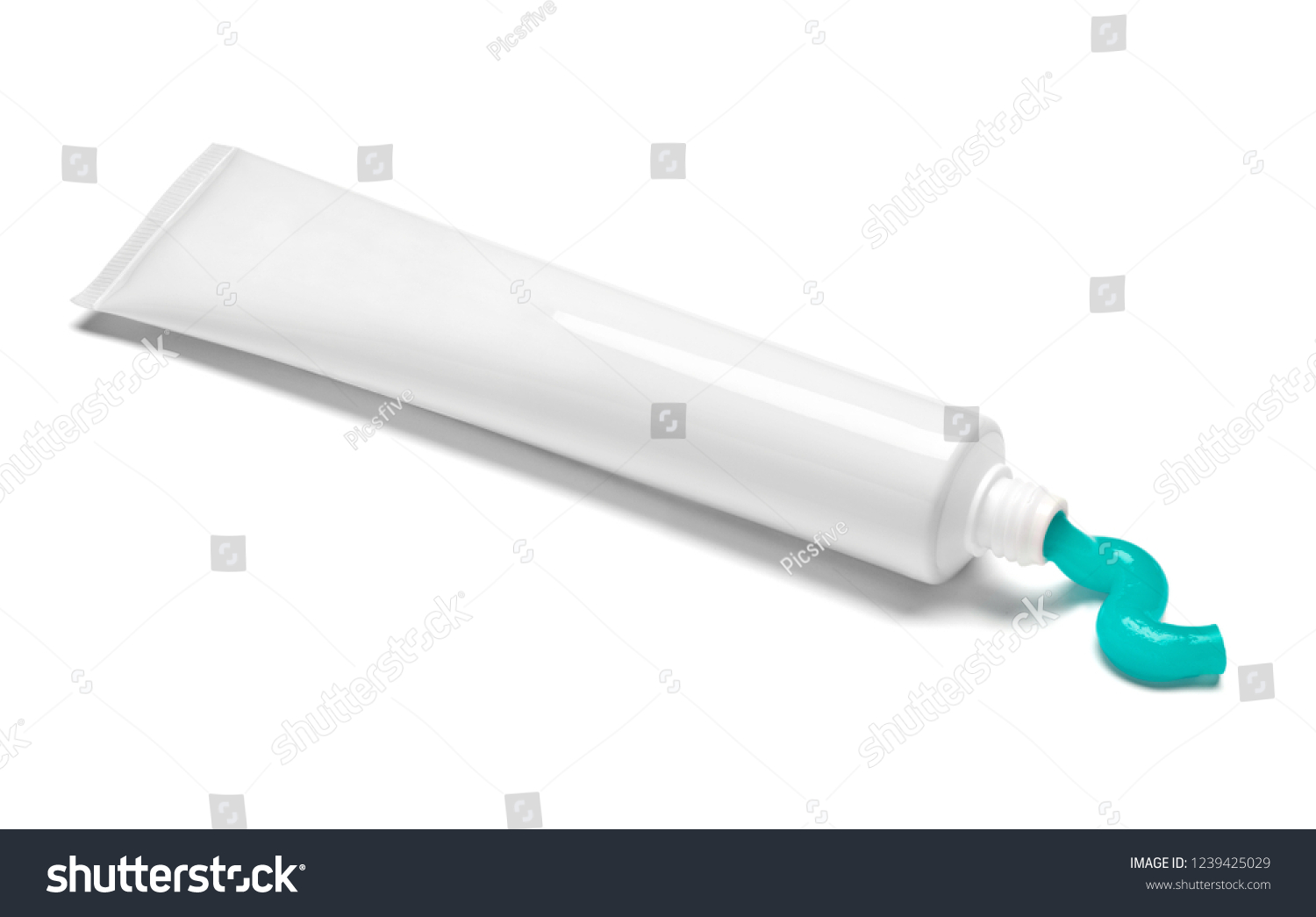 close up of  a toothpaste tube on white background #1239425029