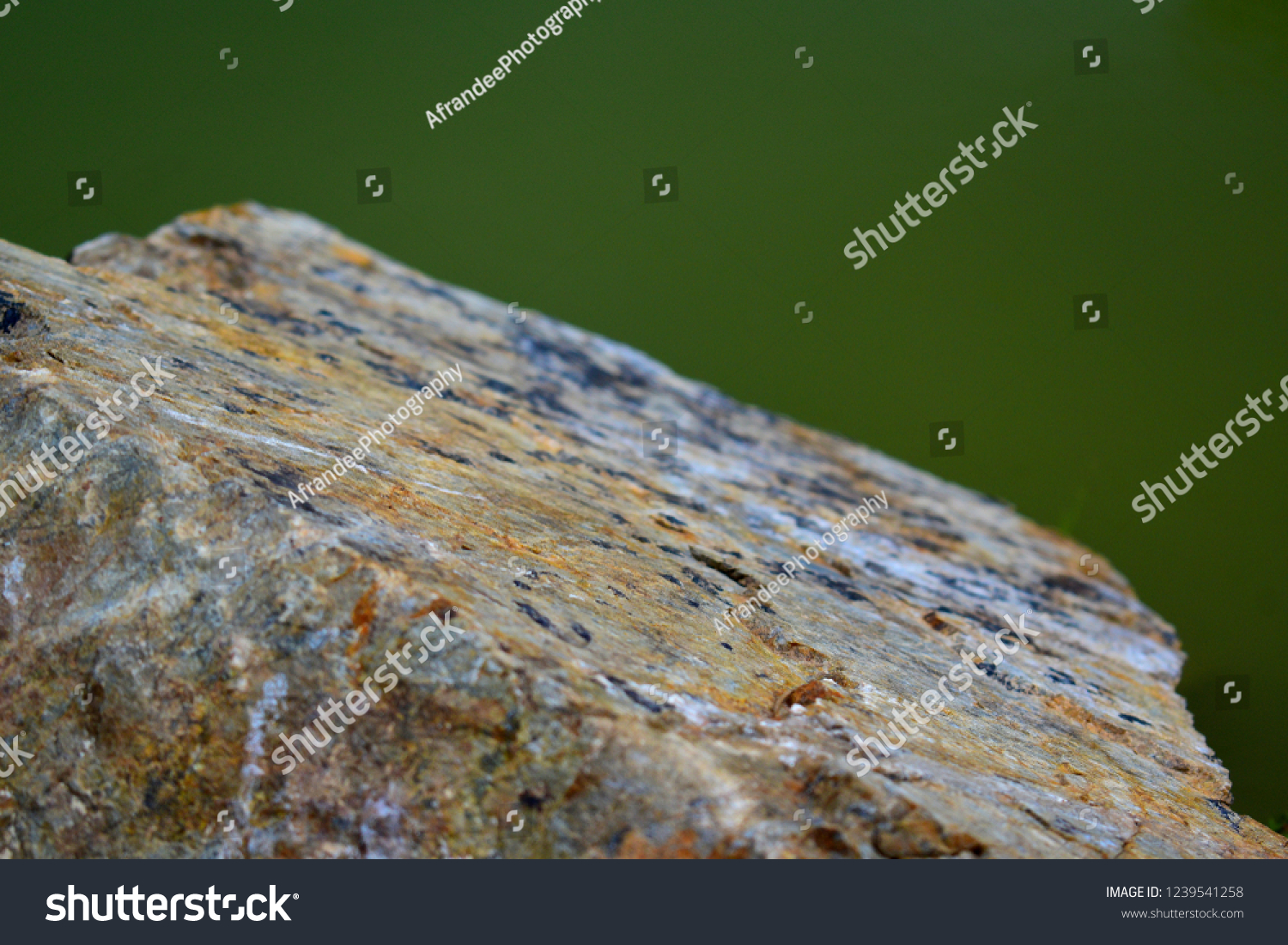 surface on stone with green blur background #1239541258