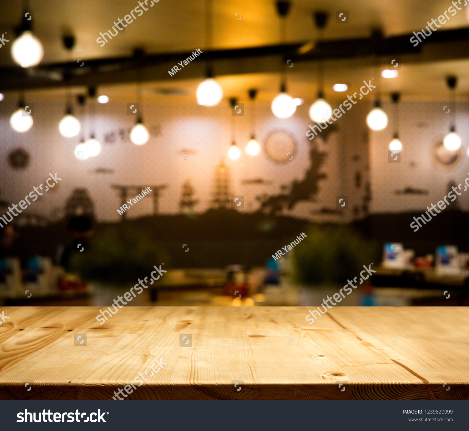 wood table top counter with night cafe club background in -use for display product on shelf with party time #1239820099