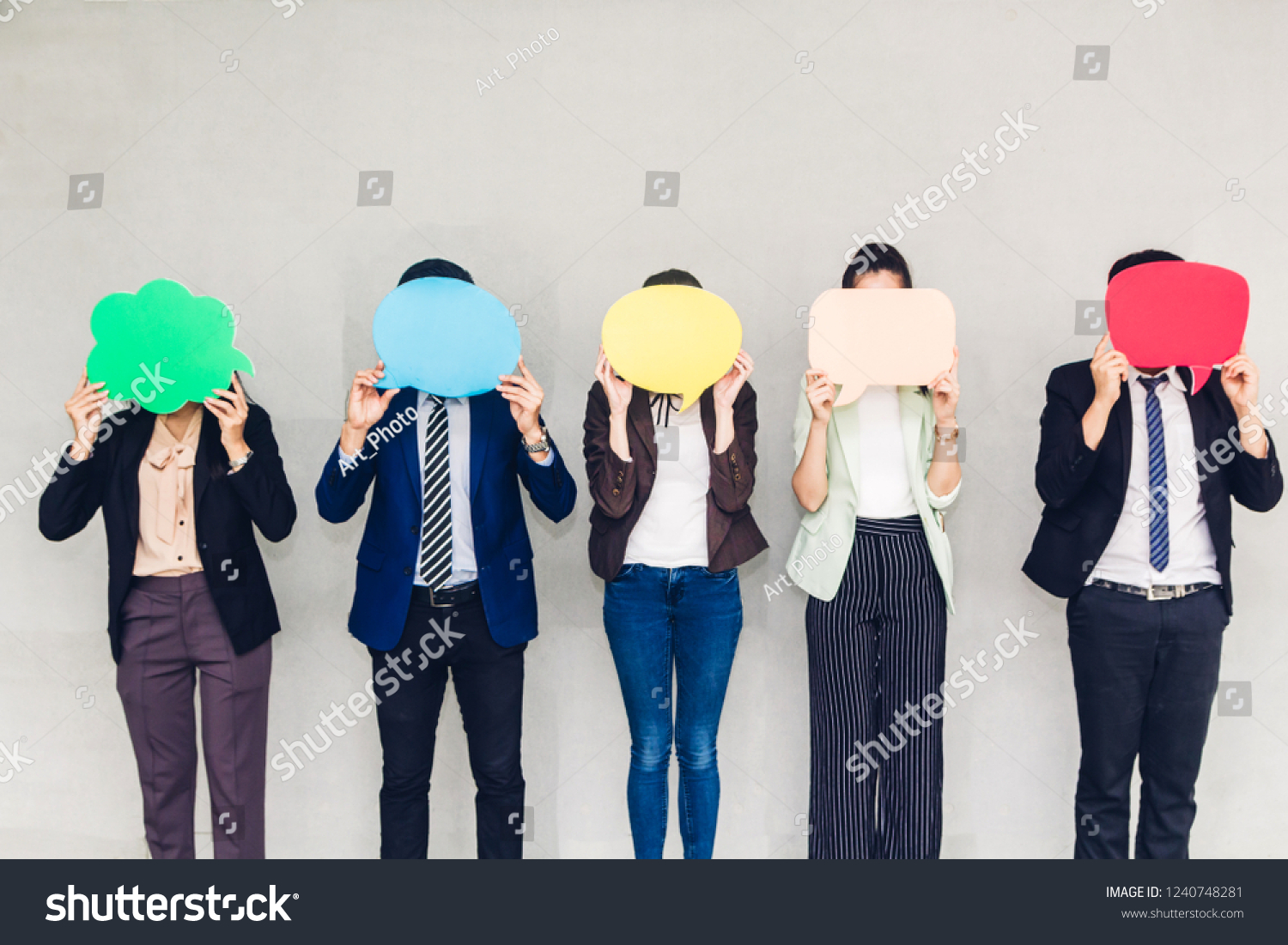 Group of business holding a speech bubble icon #1240748281