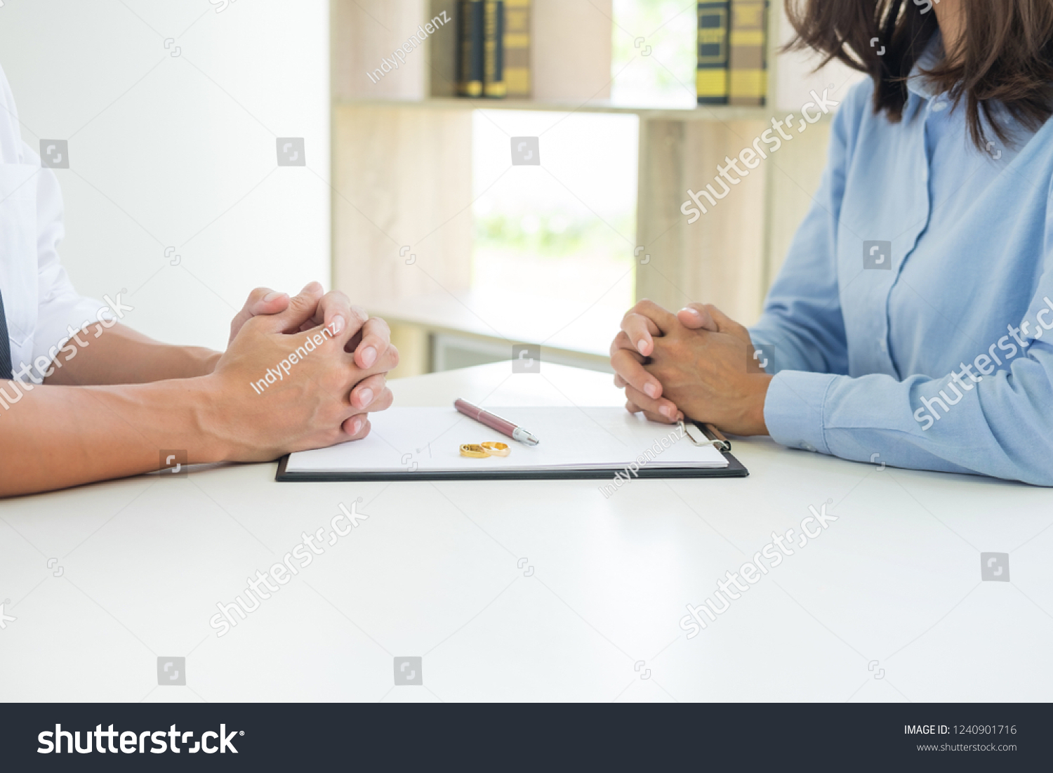 Closeup of a man Signing Contract or premarital agreement, filling petition form agreement of divorce in office at lawyer desk in court room  Conceptual of marriage. #1240901716
