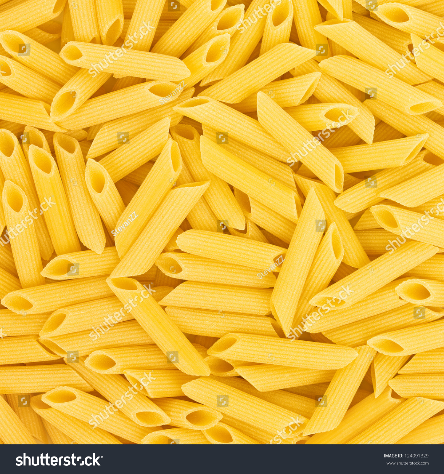 Italian Penne Rigate Macaroni Pasta raw food background or texture close up #124091329