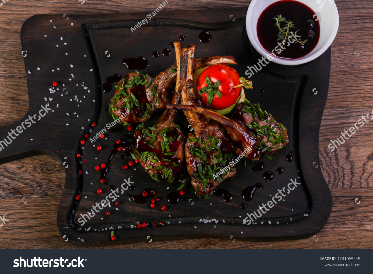 Roasted lamb ribs with sauce #1241065945