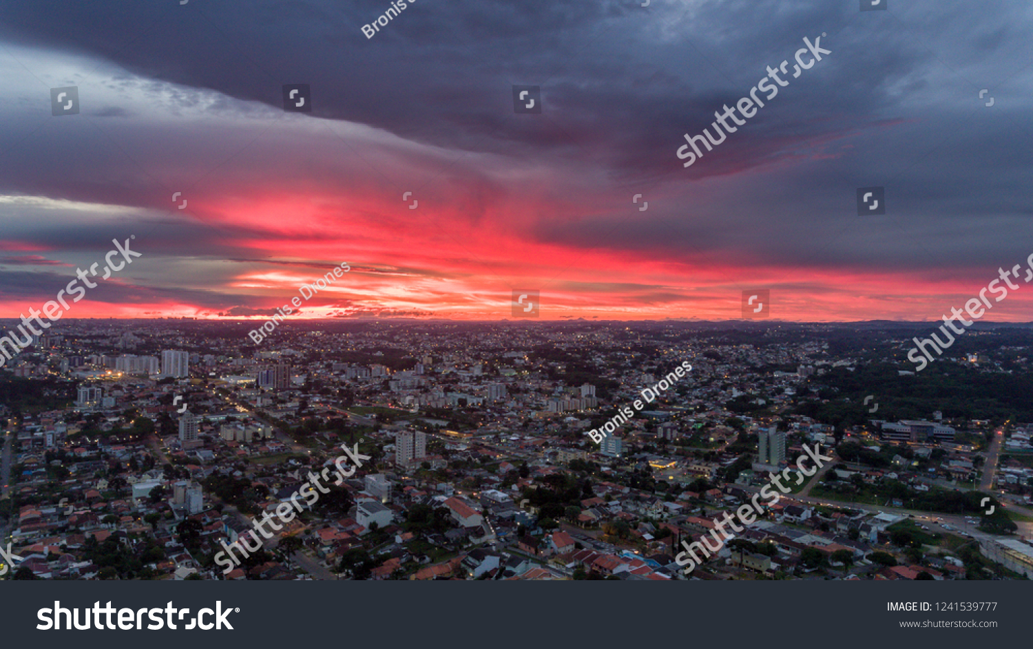 Sunset in Brazil in a gorgeous sunset after a heavy rain with red sky in blood color, image made by drone at 250 meters high.
 #1241539777