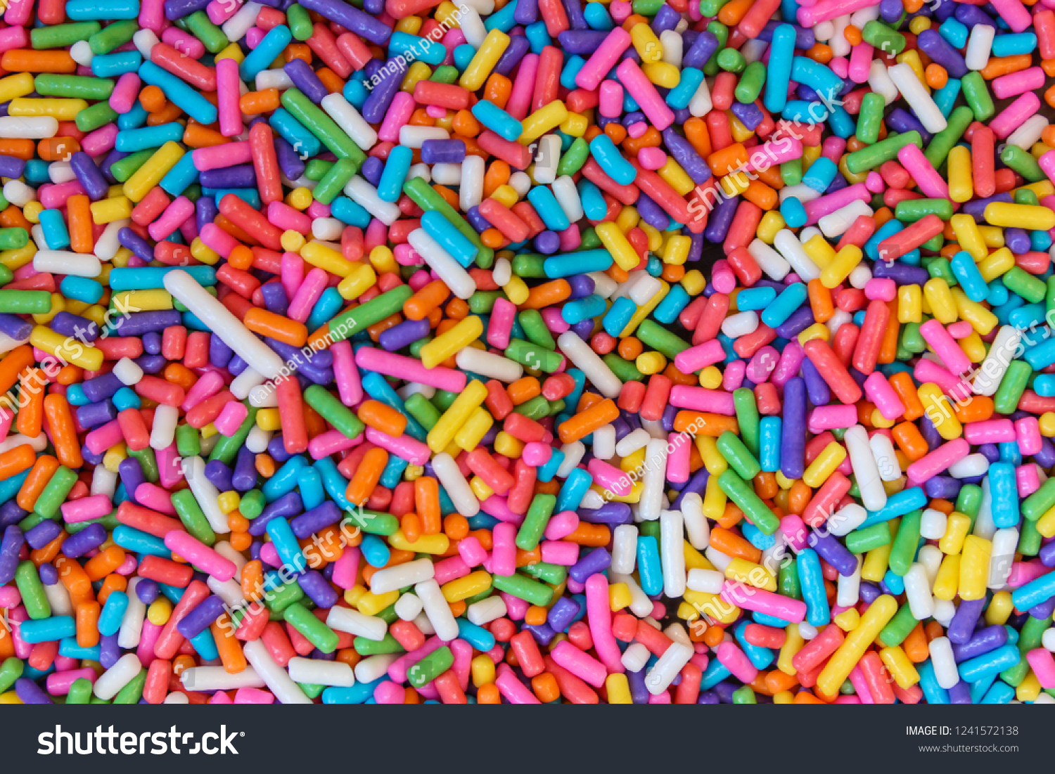 Sugar sprinkle Background Texture. decoration for cake and bekery, a lot of sprinkles as a background #1241572138