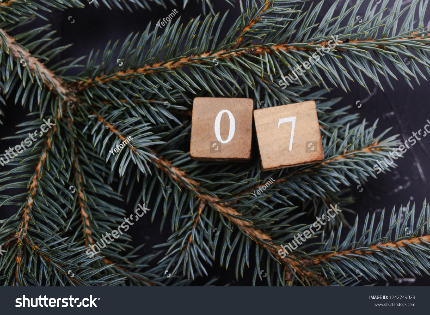 Advent calendar. Countdown to Christmas. Wooden numbers. Number seven. Christmas background. Winter background. #1242749029