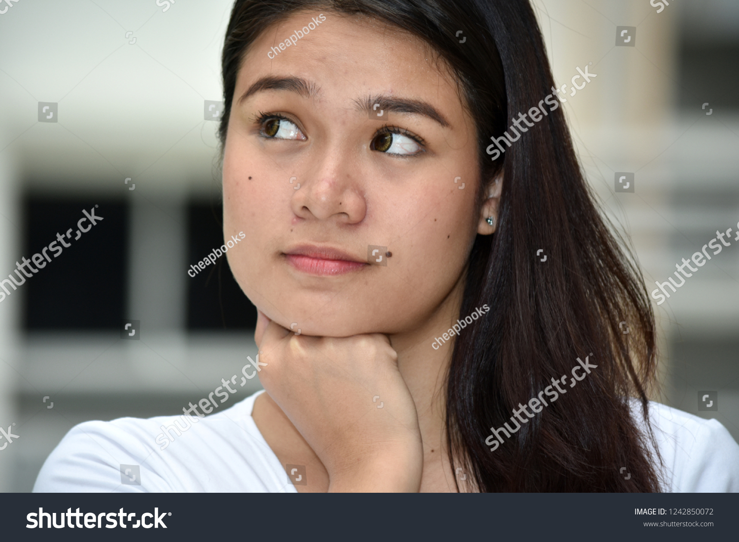 Thinking Young Asian Female #1242850072